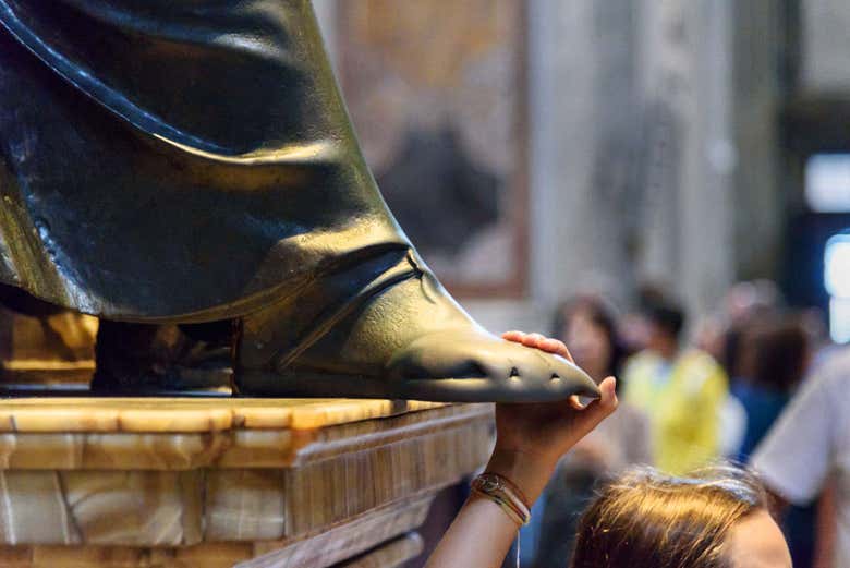 Touching the foot of St. Peter's statue